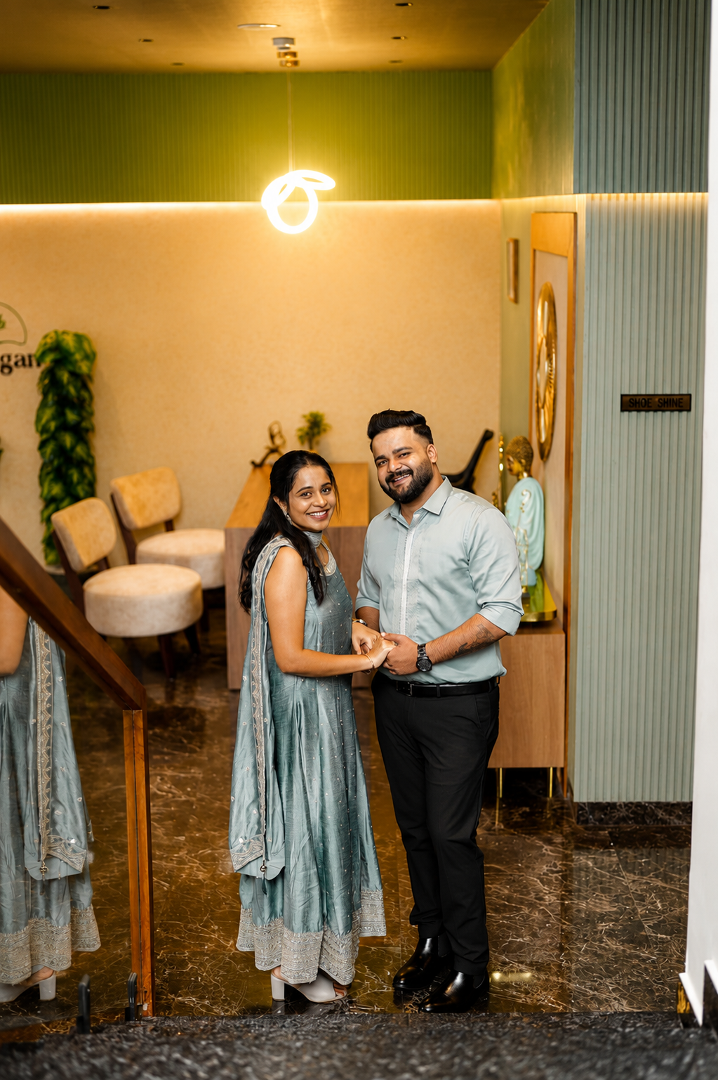 Sintomon and Sona holding hands inside a beautiful venue